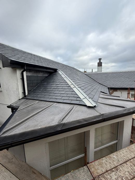 Slate hip roof & lead work