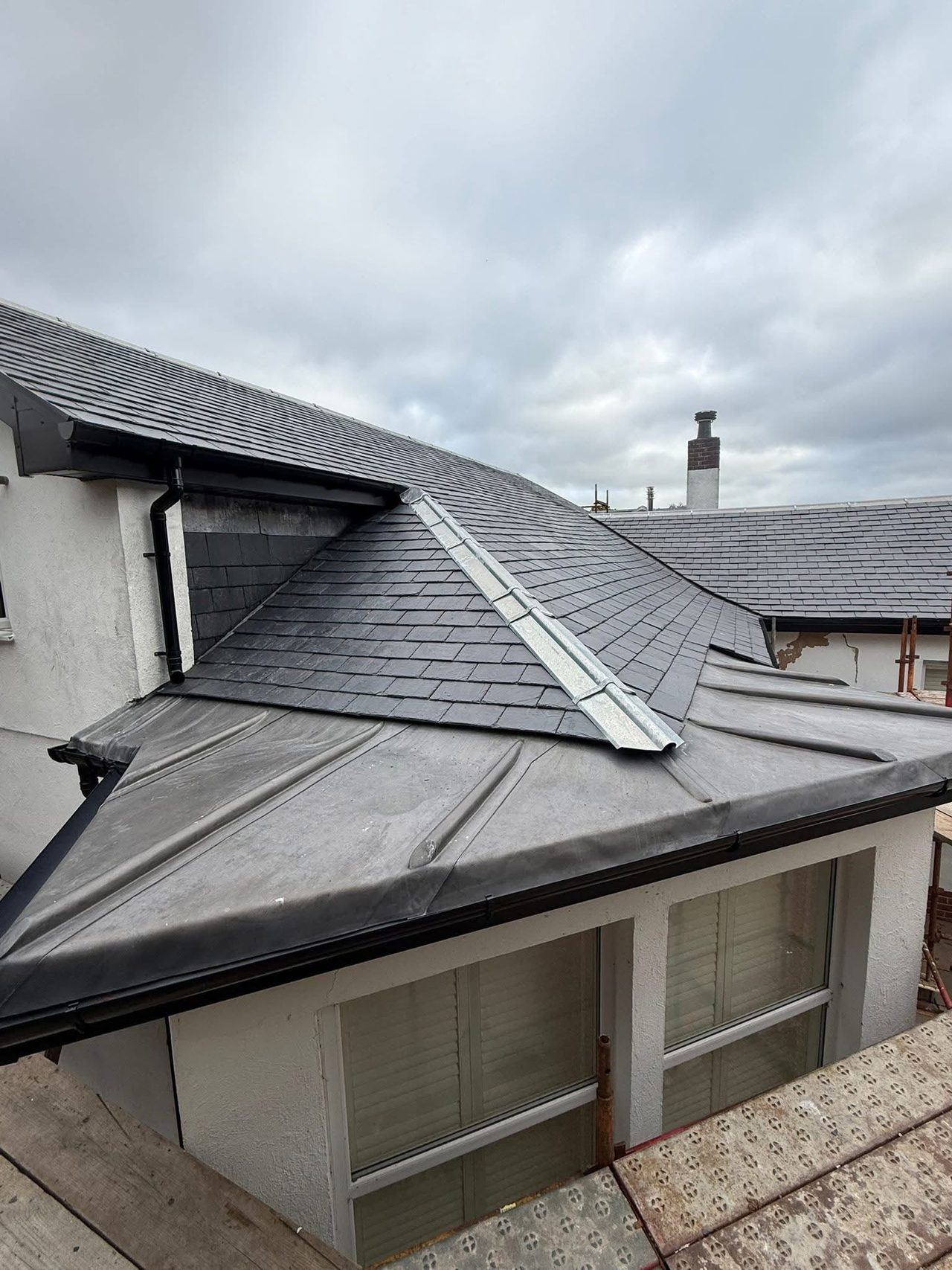 Slate hip roof & lead work